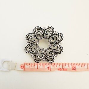 Elegant Black and Silver Brooch